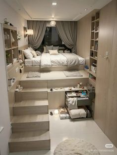 this is a bedroom with stairs leading to the bed and closets in it,