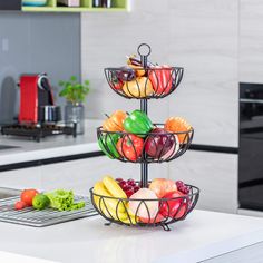 three tiered fruit bowl on the kitchen counter