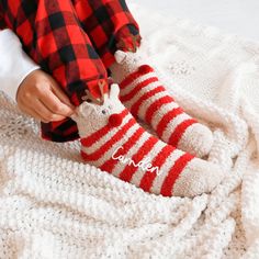 Custom Fuzzy Reindeer Socks cute personalized gift idea for friends and family this Christmas holiday season. Get them for your best friends to match at a sleepover or for Christmas morning with the family. Pair them with our comfy sleep shirts, robes, or PJs for a complete gift idea. These fuzzy crew-length socks have beige and red stripes, a cute reindeer face with antlers, and are personalized with custom names in white vinyl.  DETAILS Listing is for 1 Pair of Fuzzy Reindeer Socks with Custom Name. NO RETURNS OR EXCHANGES ON SOCKS/CLOTHING ITEMS. Style: Fuzzy Reindeer Crew Socks (text is printed in white vinyl) Size: Fits shoe sizes 5-9. NO RETURNS OR EXCHANGES ON SOCKS/CLOTHING ITEMS. CARE INSTRUCTIONS:  Wash inside out, gentle cycle, cold water, tumble dry low. More HOLIDAY Gifts http Cozy Christmas Socks For Gifts, Cozy Christmas Gift Socks, Cute Christmas Gift Socks, Cozy Winter Socks For Gift, Cozy Winter Socks For Gifts, Cozy Winter Socks Perfect For Gifts, Cozy Super Soft Socks For Gifts, Cozy Super Soft Socks As Gift, Socks Gift Ideas