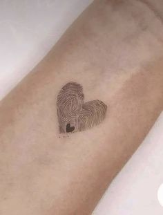 a heart shaped finger print on the arm