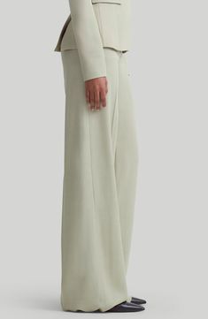 A superhigh waist further elongates the look of these wide-leg pants tailored with perfect flare and pressed creases for signature relaxed elegance. 38" inseam; 27" leg opening; 13 1/4" front rise; 17" back rise (size 8US/40FR) Zip fly with two-button closure Side-seam pockets; back welt pockets 86% viscose, 14% wool Dry clean Made in Italy Designer Clothing Elegant Wide Leg Pantsuit With Pressed Crease, Luxury Wide-leg Dress Pants, Tailored Elegant Wide Leg Pants, Elegant Tailored Wide Leg Full-length Pants, Luxury Wide Leg Dress Pants, Evening Wide Leg Pants With Pressed Crease, Formal Wide Leg Pants With Pressed Crease, Luxury Wide Leg Workwear Bottoms, Luxury Wide Leg Tailored Dress Pants