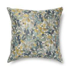 a blue and yellow floral pillow on a white background