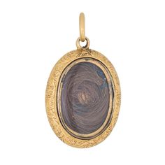 Finely detailed Victorian pendant (circa 1880s to 1900s) crafted in 18 karat yellow gold.   The oval pendant is fitted with a lock of hair behind a protective plastic case (does not open). The reverse side features an intricate decorative foliate pattern with a contrasting square pattern. The hair locket was popular during the Victorian era when a memento was placed inside a pendant or locket to memorialise a loved one.     The pendant is in very good original condition showing minimal wear.  Pa Hair Pendant, Wedding Ring Guard, Hair Locket, Victorian Hair, Lock Of Hair, Victorian Hairstyles, Victorian Pendants, Gold Baroque, Hair Locks