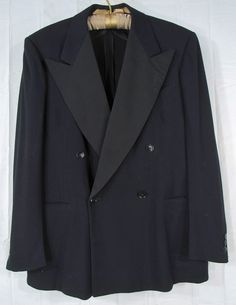 "Now here is a really nice vintage blazer. It's a 1940s Vintage Fahey Brockman Men's 4x2 Double Breasted Tuxedo Jacket, Size 22\" P2P, Union Made in USA. From what I can find, they had a store in Portland, Oregon back in the day.  The union label in this jacket dates it sometime between 1939 and 1949, so I say 40s. Style says it all, don't you think?  There is no back vent.  It's missing the inside, double breasted button. There is a mark at the lapel buttonhole from the boutonniere. :-) Superb Retro Long Sleeve Blazer For Formal Events, Retro Long Sleeve Blazer For Formal Occasions, Retro Formal Outerwear With Lapel Collar, Formal Retro Outerwear With Lapel Collar, Retro Blazer With Buttons For Formal Occasions, Retro Formal Blazer With Buttons, Formal Retro Suits With Long Sleeves, Retro Long Sleeve Formal Suit, Vintage Semi-formal Blazer With Double Button Closure