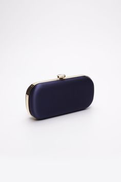 The Navy Bella Clutch is a custom designer clutch, and a timeless choice for an elegant wedding handbag. We’ve found your something blue… Your bridal purse. The Navy Bella Clutch is the perfect option for an evening wedding, as the duchess satin feels luxurious and sensible, without sacrificing style. Perhaps you’re celebrating on the New England coast at a chic hotel or private estate, complete your look with a stylish and elevated custom purse that you’ll love for years to come. The Bella Clut Elegant Satin Clutch Bag, Luxury Compact Evening Clutch, Modern Blue Clutch For Formal Occasions, Elegant Evening Bag With Satin Lining For Wedding, Elegant Gold Compact Clutch, Wedding Evening Bag With Satin Lining, Elegant Rectangular Satin Bag, Elegant Satin Rectangular Bag, Rectangular Satin Wedding Bag