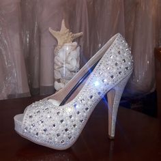 Material: Leather Upper/Rhinestone Condition: New In Box Size: 8.5 Occasions: Formal, Wedding, Party Crystal Wedding Shoes With Rhinestones, Crystal Wedding Shoes With Rhinestones For Prom, Glamorous Crystal Wedding Shoes For Prom, Glamorous Wedding Shoes With Rhinestones And Round Toe, Crystal Embellished Heels For Prom, Silver Rhinestone Wedding Shoes For Prom, Glamorous Wedding Shoes With Rhinestones, Formal Wedding Party, Rhinestone High Heels