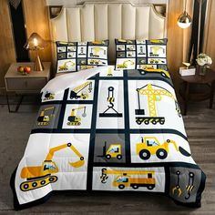 a bed with construction themed comforters and pillows