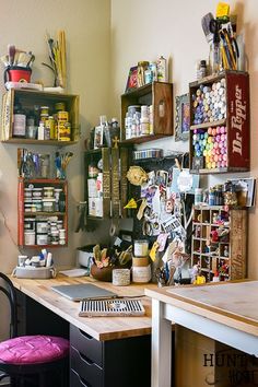 a craft room with lots of craft supplies on the shelves