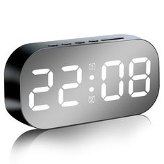 an alarm clock is shown with the time at 11 53 pm on it's side