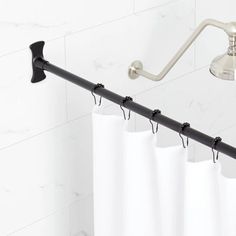 a shower curtain rod is attached to the wall