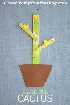 a plant made out of popsicle sticks with hearts on it and the words cactus