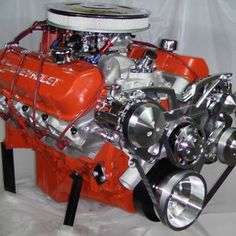 an orange and silver engine is on display