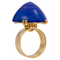 This exceptional Jean Despres ring in 18 karat planished gold features a high-rise sugarloaf cabochon lapis lazuli resting on decorative gold beadwork. It was made in c. 1940 and is stamped with the maker’s mark and French assay marks. Després (1889 - 1980) apprenticed with a goldsmith at age 16 and emerged over the Art Deco years as a brilliant "studio" jeweler who made all his work himself and drew from diverse influences to shape his unique creations: his friendships with the most avant-garde Jean Despres, Yellow Gold Cocktail Ring, Contemporary Art Deco, Iconic Art, Modernist Ring, Lapis Lazuli Jewelry, Gold C, Machine Age, Lapis Ring