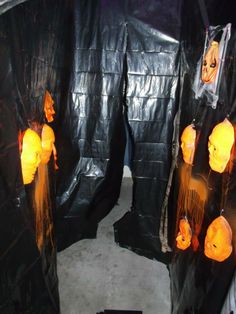 there are some black plastic bags with orange lights on them