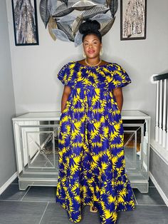 This Ankara cold shoulder maxi dress is the perfect way to add a touch of African flair to your wardrobe. The vibrant print and flattering silhouette will make you stand out from the crowd. The dress is made from a lightweight cotton fabric that is comfortable to wear all day long. Length 58" inches  Burst 36" inches to 40 inches Summer Cotton Maxi Dress With Vibrant Print, Yellow Floral Cotton Maxi Dress, Casual Off-shoulder Printed Maxi Dress, Off-shoulder Cotton Dress For Vacation, Cotton Off-shoulder Vacation Dress, Off-shoulder Cotton Vacation Dress, Cotton Maxi Dress With Vibrant Print, Printed Short Sleeve Cotton Maxi Dress, Printed Cotton Maxi Dress With Short Sleeves