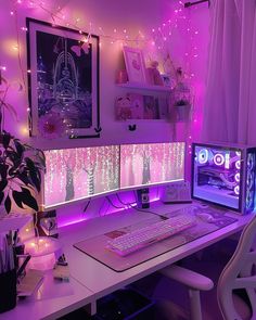 a computer desk with two monitors and a keyboard in front of purple lights on the wall