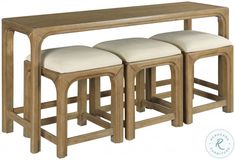 three stools and a wooden table with white cushions on it, against a white background