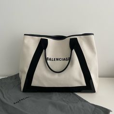 Balenciaga Medium Navy Cabas Canvas Tote Bag. Have Used A Few Times. Show Signs Of Wear. Please See Attached Pictures. In Good Condition. Width: 17” Height: 13” Depth: 8” Bags Balenciaga, Balenciaga Black, Canvas Tote Bag, Womens Tote Bags, Canvas Tote, Balenciaga, Black White, Tote Bag, Black And White