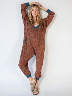 Kick back and relax in the Johnnie Jumpsuit! With its super slouchy and oversized fit, you’ll want to stay in it all day! The ribbed cuffs and deep v-neck add some structure and form making it the perfect comfy outfit choice that’s still super stylish! You’ll love wearing the Johnnie Jumpsuit on a chill Sunday morning, drinking a cup of coffee on the porch, or going on a quick errand! Stretch V-neck Jumpsuits And Rompers For Loungewear, Red V-neck Jumpsuits And Rompers For Loungewear, Casual Red V-neck Jumpsuits And Rompers, Casual Red V-neck Jumpsuit, Red V-neck Jumpsuits And Rompers, Red V-neck Jumpsuit For Fall, Red V-neck Jumpsuit For Loungewear, Relaxed Fit V-neck Jumpsuits And Rompers For Loungewear, Beautiful Boho Dresses