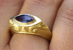 "A unique vintage-style Sapphire marquise signet ring in 14k and 18k yellow, 14k rose gold or 14k white gold. This unique signet-style ring has a magnificent blue Sapphire in a marquise cut, set in a decorated solid gold base. Handmade in Yellow, White, or Rose Gold, this Sapphire ring is eye-catching and stunning. This statement ring is made from high-quality materials that will stand the test of time, making this bold and original piece a part of your wardrobe for years to come. This gemstone Gold Marquise Ring, Marquise Sapphire, Boho Engagement Ring, Beautiful Gold Rings, White Gold Sapphire Ring, Unique Gold Rings, Engagement Ring Gold, Signet Rings Women, Gold Sapphire Ring