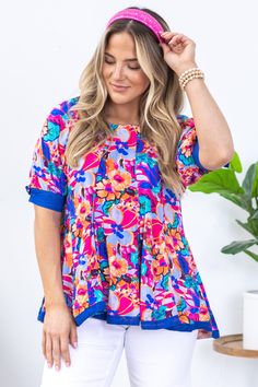 Product Details Colors: Blue, Teal, Orange, Hot Pink, Periwinkle, Purple, Brown Print: Floral Neckline: Round Sleeve: Short Sleeve Hemline: Straight Brand: Umgee Material and Care 100% Rayon Contrast: 100% Cotton Hand Wash Cold Hang/Line Dry Size and Fit Small: Bust 38" Waist 40" Front Length 25" Back Length 27" Medium: Bust 40" Waist 42" Front Length 25.5" Back Length 27.5" Large: Bust 42" Waist 44" Front Length 26" Back Length 28" Photo model is 5'7 and wearing a size small Vibrant Blue Top With Colorful Pattern, Vibrant Blue Tops With Colorful Pattern, Vibrant Blue Top For Beach, Vibrant Blue Beach Top, Blue Tops With Colorful Pattern For Summer, Vibrant Blue Tops For Vacation, Pink Short Sleeve Blouse With Colorful Pattern, Playful Short Sleeve Blouse, Pink Blouse With Colorful Pattern And Short Sleeves