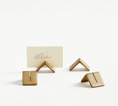 three pieces of wood that have been placed on top of each other, with the word'alili'written on them