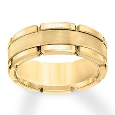 a yellow gold wedding band with rounded edges and beveled in the center, on a white background