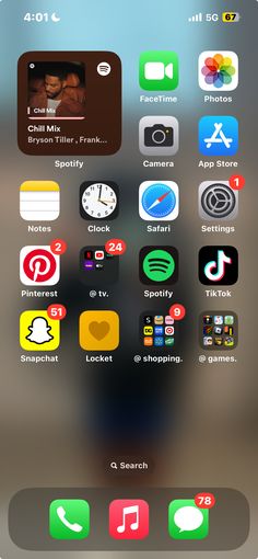 an iphone screen with several different icons on the phone and in front of it is a blurry background