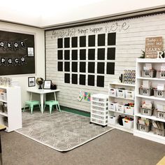 the room is decorated in white and black with lots of chalk writing on the walls