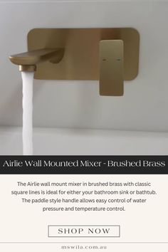 a faucet that is connected to a wall mounted mixer - brushed brass finish