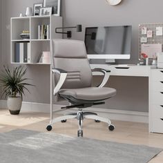 an office chair sitting in front of a computer desk