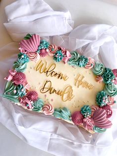 a decorated cake with the words welcome home on it