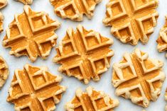 several waffles are arranged on a sheet of paper