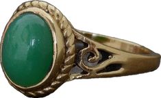 an antique ring with a green stone in the center