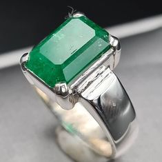 *I ship From Pakistan as my workshop is there. This is the reason we offer as much low prices compared to our regional jewellers* Natural Unheated Untreated beautiful Swat Rich green dark Emerald Rich Green Beautiful Color Highest Quality Emerald Premium 925 Sterling Silver Ring size 8 US Resize able as per buyer choice Stone weight 4.90 ct Premium Quality Engagement Ring Anniversary Ring Shipping option is FedEx Three working days Handling Time Contact me in case of any question about the item Emerald Wedding Band, Emerald Band, Natural Emerald Rings, Green Emerald Ring, Rich Green, Emerald Stone, Green Dark, Green Emerald, Multi Stone Ring