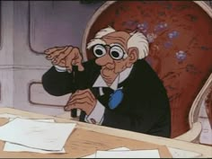 an old man sitting at a table with papers on it and looking into the distance