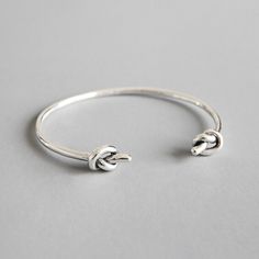 Store Categories Store Categories Other Ladies 925 Sterling Silver Knot Torque Bangle Gift ， Product Description Description Excellent quality sterling silver Double Knot Torque Bangle. Handmade by an experienced silversmith with a polished finish. This bangle features a simple but elegant design fit for any occasion. RRP would be in excess of £50. With years of experience selling Sterling Silver Jewellery, I can guarantee the quality of my product. Bangle can be slightly adjusted to fit your wrist comfortably. Hallmarked 925 Sterling Silver.  Inner Diameter: 60mm by 50mm Thickness: 2.5mm Weight: Approx. 10 grams Payment Policy Shipping Policy Returns Policy About Us Payment Policy The only payment method we accept so far is eBay Management Payment . If this brought up any inconvenience to Silver Sterling Bangle, Sterling Silver Bracelet With Simple Design For Gifts, Sterling Silver Bracelet Simple Design Gift, Adjustable Silver Sterling Silver Bangle, Silver Sterling Bracelet Simple Design Gift, Gift Sterling Silver Bracelet Simple Design, Gift Sterling Silver Bracelet With Simple Design, Minimalist Sterling Silver Bangle With Silver Clasp, Simple Adjustable Sterling Silver Bracelet