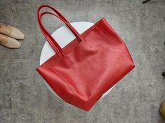 Overview: Design: Fashion Womens Red Leather Oversize Tote Bag Red Shoulder Tote Bag Handbag Tote For WomenIn Stock: Made to order (2-3 days)Include: Tote + A detachable Side InnerCustom: NoColor: RedLeather: CowhideMeasures: Horizontal Style S: 46cm/Bottom 34cm x 30cm x 14cmHorizontal Style L: 50cm/Bottom 37cm x 33cm x 16cm Vertical Style S: 41cm/Bottom 33cm x 35cm x 11cm Vertical Style L: 47cm/Bottom 37cm x 40cm x 11cmWeight: 0.75 kgSlots: 1 slotAccessories(option): NoStyle: Tote Bag, Shoulder Overview Design, Oversized Tote Bag, Oversized Tote, Shoulder Tote Bag, Shoulder Tote, Design Fashion, Bag Shoulder, Tote Handbags, Lady In Red