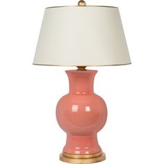 a pink lamp with a white shade on it