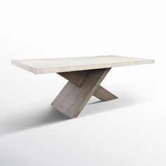 a concrete table sitting on top of a white floor