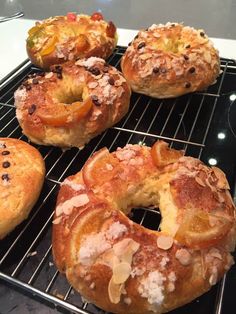 four bagels cooling on a rack in the oven, ready to be baked and eaten