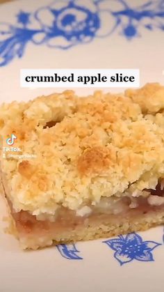 a close up of a piece of food on a plate with the words crumbd apple slice