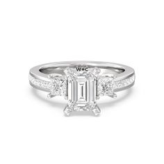 an emerald cut diamond ring with side stones