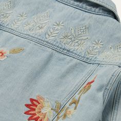 The denim jacket is a true essential, a storied piece of authentic Western outerwear. This version adds flower embroidery for a playful and feminine take on a classic. Finished with authentic details like back waist tabs, flap chest pockets, and metal buttons throughout. Sure to be a favorite throughout the season, and in seasons to come. 100% Cotton Welted Side Pockets Patch Back Yoke Straight Front Yoke Drop Shoulders Embroidered Imported Medium Wash Denim Jacket With Floral Embroidery For Summer, Summer Outerwear With Floral Embroidery In Medium Wash, Medium Wash Floral Embroidered Denim Jacket For Summer, Summer Medium Wash Denim Jacket With Floral Embroidery, Summer Floral Embroidery Medium Wash Outerwear, Embroidered Denim Jacket With Relaxed Fit, Summer Floral Embroidered Denim Jacket In Medium Wash, Denim Blue Cotton Outerwear With Floral Embroidery, Medium Wash Cotton Denim Jacket With Floral Embroidery