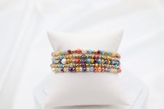 The Gold Multi Stone Bead Bracelet Set is a vibrant collection of bracelets adorned with an array of colorful stone beads, each accented with elegant gold touches. This set offers a versatile and eye-catching accessory option, perfect for adding a splash of color and sophistication to any outfit. Size: 6” - Inner Diameter Closure: Elastic Material: Zinc, Brass and Steel with Rhodium Plating Lead and Cadmium Safe - It is not Nickel Free Elegant Multicolor Stackable Beaded Bracelets, Elegant Multicolor Stackable Stretch Bracelet, Adjustable Multicolor Pearl Bracelet With 8mm Beads, Multicolor Adjustable Pearl Bracelet With 8mm Beads, Multicolor Stretch Bracelet With Gold Beads As Gift, Multicolor Gold Beads Stretch Bracelet Gift, Elegant Multicolor Beaded Bracelets With Tiny Beads, Elegant Multicolor Bracelets With Tiny Beads, Elegant Multicolor Stretch Bracelet With Colorful Beads