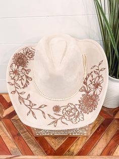 Wild Child Floral Burned Hat, Floral Engraved Cowboy Hat, Sunflower Hat, Sunflower Burned Fedora, Engraved Suede Hat, Boho Hat, Vegan Suede Elevate your style with our beautifully engraved floral hats! Choose from a variety of different hat colors. Band may shift or fall off during shipping. The hat has an adjustable ribbon on the inside and can fit anywhere from 20-24.5" heads. This hat can fit children and adults. If you are looking for a custom order, please message us! We ship all of our hat Western Style Felt Beach Cap, Cream Country Hat For Kentucky Derby, Cream Country Hat For Festivals, Country Style Cream Hat For Kentucky Derby, Country Style Cream Hat For Festivals, Cream Country Style Hat For Festivals, Cream Wide Brim Country Hat, Country Style Cream Fedora For Festivals, Country Style Wide Brim Cream Hat