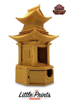 a wooden model of a pagoda with the words little prints on it's side