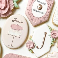 decorated cookies are displayed on a table