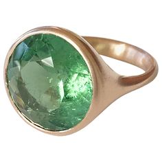 Dalben design 18k rose gold matte finishing ring with a green 11,36 carat bezel-set round faceted cut Tourmaline. The tourmaline have some natural inclusions. Ring size 7 1/4 USA - EU 55 re-sizable to most finger sizes. Bezel stone dimensions : height 16,9 mm width 16,9 mm The ring has been designed and handcrafted in our atelier in Como Italy with a rigorous quality workmanship . Stone Ring Design, Brown Diamond Ring, Yellow Gold Cocktail Ring, Green Tourmaline Ring, Ring Rosegold, Tanzanite Diamond Ring, Retro Ring, Como Italy, Gold Cocktail Ring