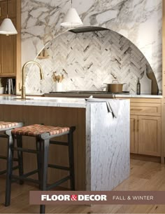 a kitchen with marble counter tops and stools in front of an oven hood over the stove